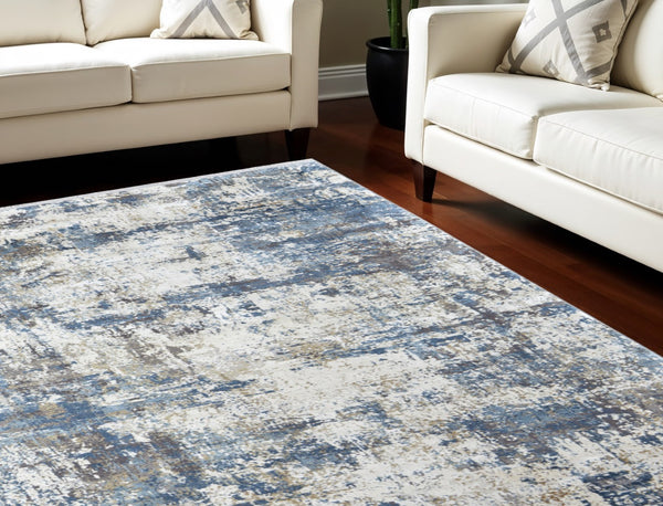 HomeRoots 3' Elevate Your Space with a Stylish Ivory Tan and Blue Abstract Power Loom Area Rug with Fringe 12' X 15' 566040