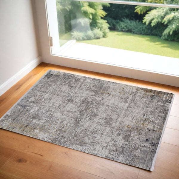 HomeRoots 3' Ivory Taupe and Gray Abstract Power Loom Distressed Area Rug with Tasseled Fringe Elegance 3' X 5' 566042