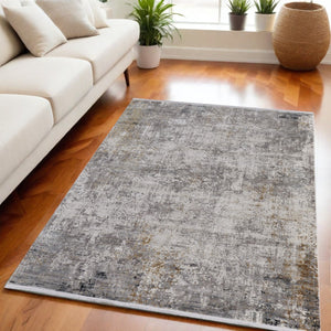 HomeRoots 3' Ivory Taupe and Gray Abstract Power Loom Distressed Area Rug with Tasseled Fringe Elegance 5' X 8' 566043