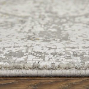 HomeRoots 3' Ivory Taupe and Gray Abstract Power Loom Distressed Area Rug with Tasseled Fringe Elegance 7' X 10' 566044