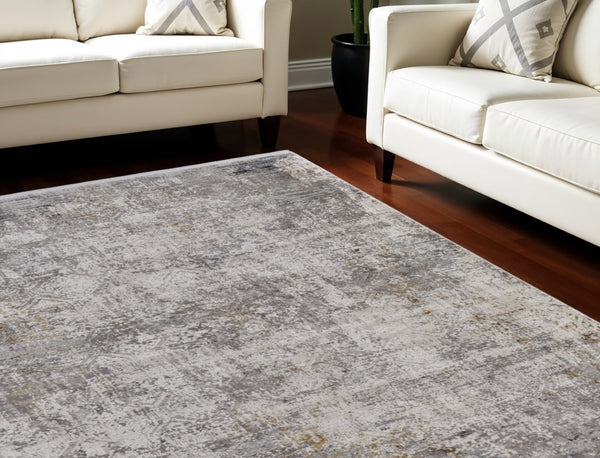 HomeRoots 3' Ivory Taupe and Gray Abstract Power Loom Distressed Area Rug with Tasseled Fringe Elegance 7' X 10' 566044