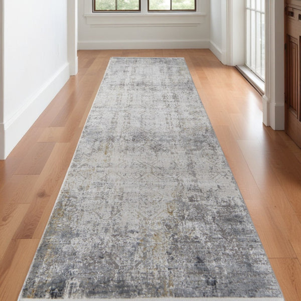 HomeRoots 3' Ivory Taupe and Gray Abstract Power Loom Distressed Area Rug with Tasseled Fringe Elegance 10' Runner 566047