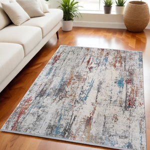 HomeRoots 3' Gray Blue and Red Abstract Power Loom Area Rug with Tassels - Elevate Your Space Instantly! 5' X 8' 566063
