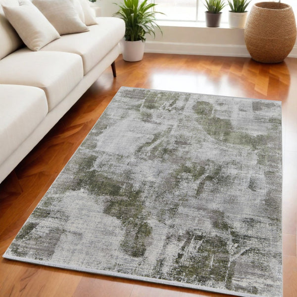 HomeRoots 3' Modern Ikat Area Rug in Gray-Silver and Green with Fringe - Durable Power Loom Design for Any Room 5' X 8' 566078