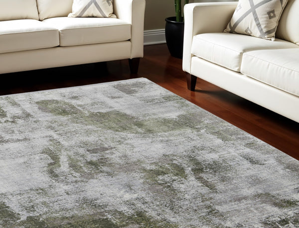 HomeRoots 3' Modern Ikat Area Rug in Gray-Silver and Green with Fringe - Durable Power Loom Design for Any Room 7' X 10' 566079