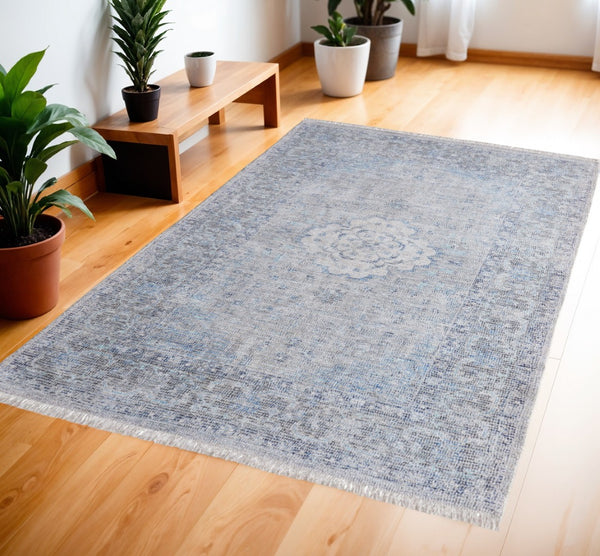 HomeRoots 4' Hand-Woven Distressed Oriental Area Rug in Gray, Blue, and Ivory with Classic Fringe Detail 4' X 6' 566157