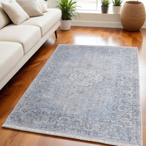 HomeRoots 4' Hand-Woven Distressed Oriental Area Rug in Gray, Blue, and Ivory with Classic Fringe Detail 5' X 8' 566158