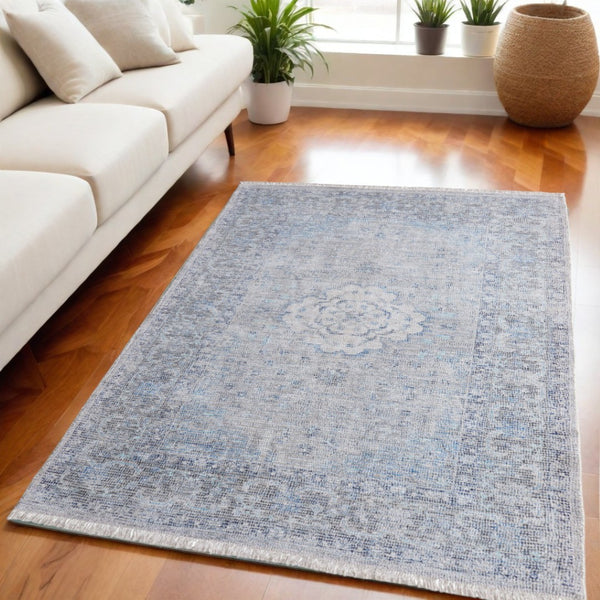 HomeRoots 4' Hand-Woven Distressed Oriental Area Rug in Gray, Blue, and Ivory with Classic Fringe Detail 5' X 8' 566158