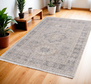 HomeRoots 4' Hand Woven Tan and Gray Oriental Area Rug - Vintage Charm with Distressed Design and Fringe 4' X 6' 566169