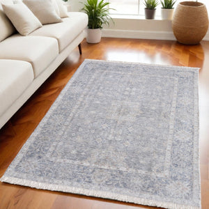 HomeRoots 4' Hand-Woven Abstract Area Rug in Gray-Blue and Taupe - Distressed Design with Fringed Edges 5' X 8' 566176