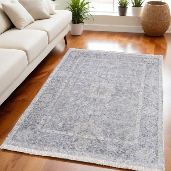 HomeRoots 4' Hand-Woven Abstract Area Rug in Gray-Blue and Taupe - Distressed Design with Fringed Edges 5' X 8' 566176