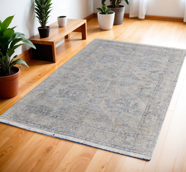 HomeRoots 4' Gray Blue and Taupe Hand-Woven Distressed Area Rug with Fringe for Timeless Home Elegance 4' X 6' 566181
