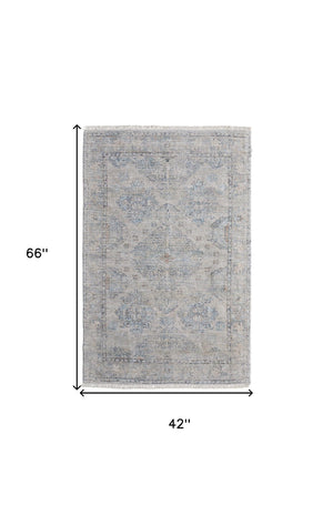 HomeRoots 4' Gray Blue and Taupe Hand-Woven Distressed Area Rug with Fringe for Timeless Home Elegance 4' X 6' 566181