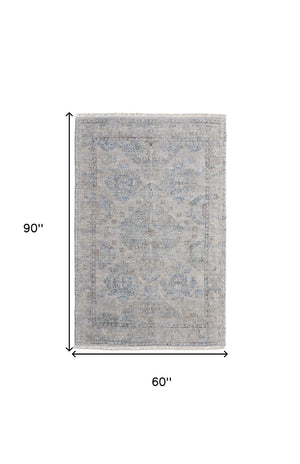 HomeRoots 4' Gray Blue and Taupe Hand-Woven Distressed Area Rug with Fringe for Timeless Home Elegance 5' X 8' 566182