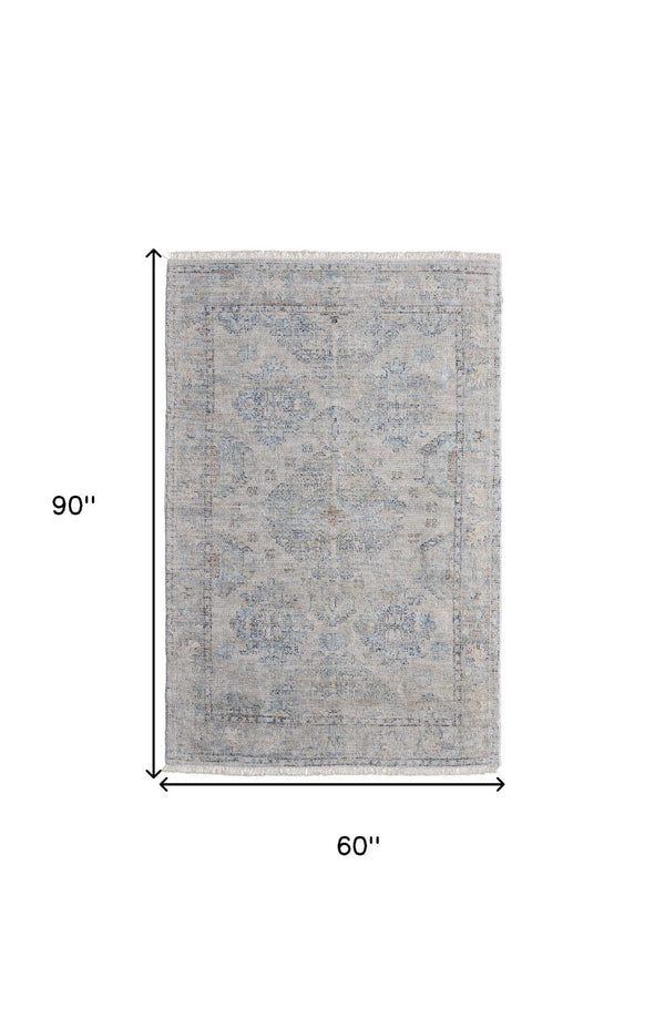 HomeRoots 4' Gray Blue and Taupe Hand-Woven Distressed Area Rug with Fringe for Timeless Home Elegance 5' X 8' 566182