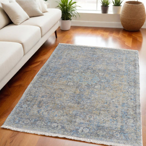 HomeRoots 4' Hand-Woven Distressed Area Rug in Gray Blue and Tan with Artistic Fringe for Modern Spaces 5' X 8' 566188
