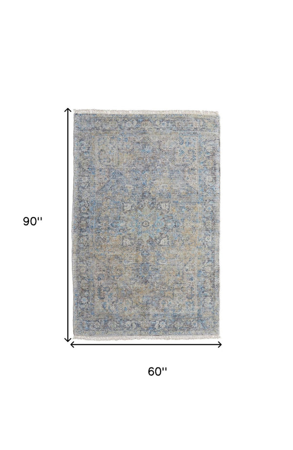 HomeRoots 4' Hand-Woven Distressed Area Rug in Gray Blue and Tan with Artistic Fringe for Modern Spaces 5' X 8' 566188