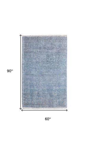 HomeRoots 5' Hand Woven Blue and Gray Abstract Area Rug with Distressed Finish and Stylish Fringed Edges 5' X 8' 566193