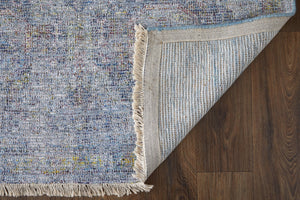 HomeRoots 4' Blue and Ivory Abstract Hand-Woven Area Rug with Fringed Tassels – Unique Distressed Design 5' X 8' 566199