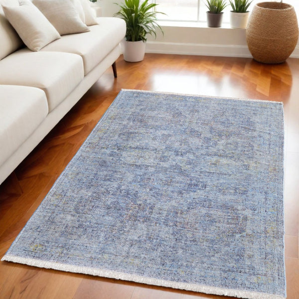 HomeRoots 4' Blue and Ivory Abstract Hand-Woven Area Rug with Fringed Tassels – Unique Distressed Design 5' X 8' 566199