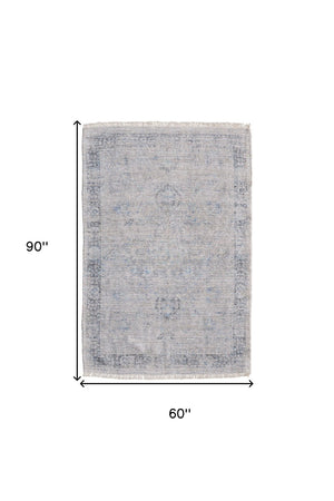 HomeRoots 4' Hand-Woven Distressed Area Rug in Gray-Blue & Taupe - Unique Abstract Design with Fringe 5' X 8' 566205