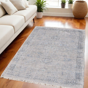 HomeRoots 4' Hand-Woven Distressed Area Rug in Gray-Blue & Taupe - Unique Abstract Design with Fringe 5' X 8' 566205