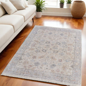 HomeRoots 4' Hand-Woven Distressed Floral Area Rug in Ivory Tan and Blue with Tasseled Fringe for Elegance 5' X 8' 566211