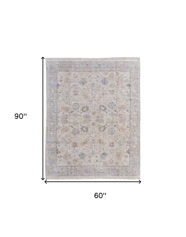 HomeRoots 4' Hand-Woven Distressed Floral Area Rug in Ivory Tan and Blue with Tasseled Fringe for Elegance 5' X 8' 566211