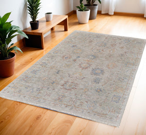 Homeroots 4' X 6' Tan Brown And Blue Floral Hand Woven Distressed Area Rug With Fringe Brown Wool Blend 566222