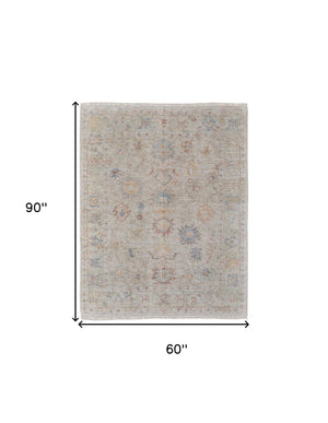 Homeroots 5' X 8' Tan Brown And Blue Floral Hand Woven Distressed Area Rug With Fringe Brown Wool Blend 566223