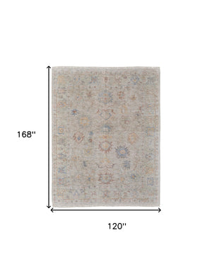 Homeroots 10' X 14' Tan Brown And Blue Floral Hand Woven Distressed Area Rug With Fringe Brown Wool Blend 566226