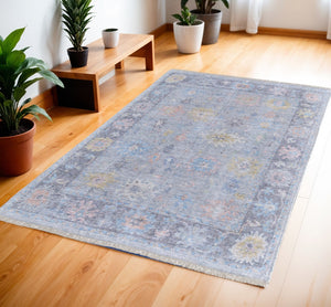 HomeRoots 4' Hand Woven Distressed Floral Area Rug in Orange, Blue & Gold - Vintage Charm with Fringe Edges 4' X 6' 566228