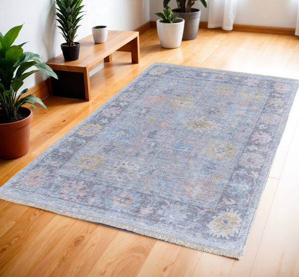 HomeRoots 4' Hand Woven Distressed Floral Area Rug in Orange, Blue & Gold - Vintage Charm with Fringe Edges 4' X 6' 566228