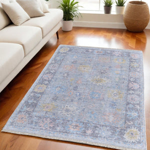 HomeRoots 4' Hand Woven Distressed Floral Area Rug in Orange, Blue & Gold - Vintage Charm with Fringe Edges 5' X 8' 566229