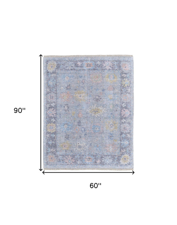 HomeRoots 4' Hand Woven Distressed Floral Area Rug in Orange, Blue & Gold - Vintage Charm with Fringe Edges 5' X 8' 566229