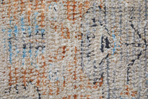 HomeRoots 4' Hand-Woven Ivory Blue Orange Oriental Area Rug with Distressed Finish and Elegant Fringe Detail 9' X 12' 566237
