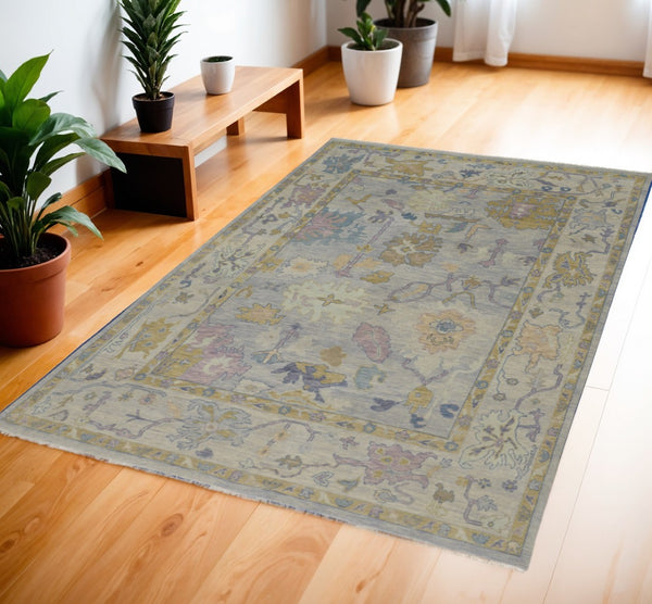 HomeRoots 4' Hand-Knotted Wool Oriental Area Rug in Rich Gold, Blue, and Purple - Timeless Elegance for Any Room 4' X 6' 566248