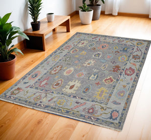 HomeRoots 4' Hand-Knotted Wool Oriental Area Rug in Gray-Blue and Red with Elegant Tasseled Fringe Design 4' X 6' 566256