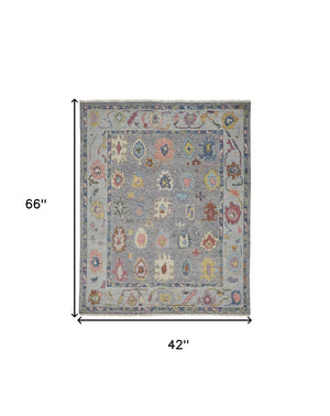 HomeRoots 4' Hand-Knotted Wool Oriental Area Rug in Gray-Blue and Red with Elegant Tasseled Fringe Design 4' X 6' 566256