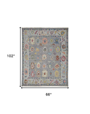 HomeRoots 4' Hand-Knotted Wool Oriental Area Rug in Gray-Blue and Red with Elegant Tasseled Fringe Design 6' X 9' 566257