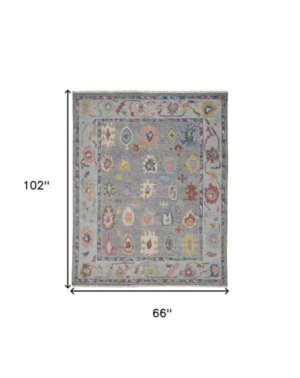 HomeRoots 4' Hand-Knotted Wool Oriental Area Rug in Gray-Blue and Red with Elegant Tasseled Fringe Design 6' X 9' 566257