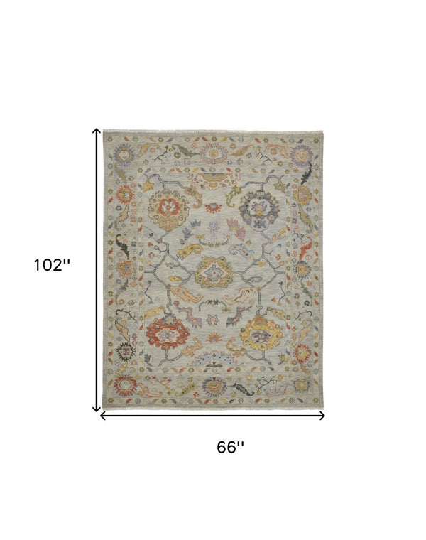 HomeRoots 4' Timeless Gray Red and Yellow Hand-Knotted Wool Oriental Rug with Fringe for Elegant Spaces 6' X 9' 566265