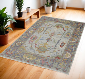 HomeRoots 4' Timeless Gray Blue and Gold Hand-Knotted Wool Oriental Area Rug with Artisan Fringed Finish 4' X 6' 566272