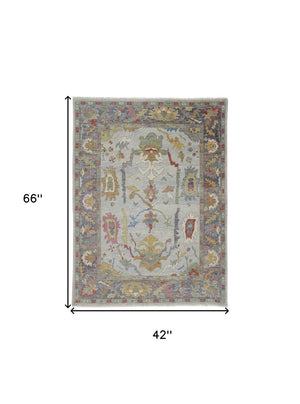 HomeRoots 4' Timeless Gray Blue and Gold Hand-Knotted Wool Oriental Area Rug with Artisan Fringed Finish 4' X 6' 566272