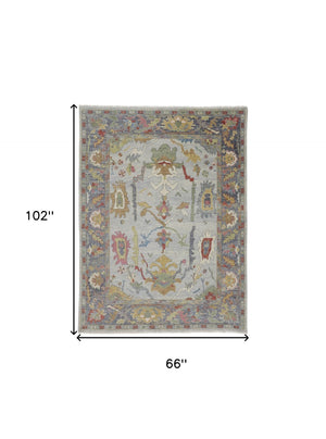 HomeRoots 4' Timeless Gray Blue and Gold Hand-Knotted Wool Oriental Area Rug with Artisan Fringed Finish 6' X 9' 566273