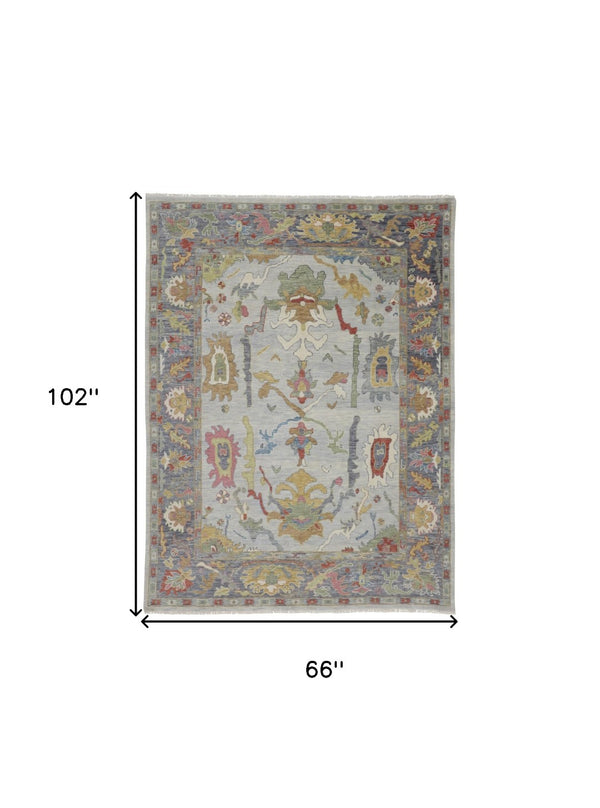 HomeRoots 4' Timeless Gray Blue and Gold Hand-Knotted Wool Oriental Area Rug with Artisan Fringed Finish 6' X 9' 566273