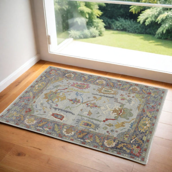 HomeRoots 4' Timeless Gray Blue and Gold Hand-Knotted Wool Oriental Area Rug with Artisan Fringed Finish 2' X 3' 566279
