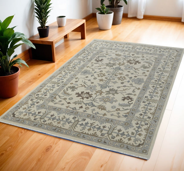 HomeRoots 4' Hand-Knotted Wool Area Rug with Floral Design and Tassel Fringe for Timeless Home Décor 4' X 6' 566286