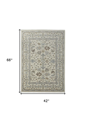 HomeRoots 4' Hand-Knotted Wool Area Rug with Floral Design and Tassel Fringe for Timeless Home Décor 4' X 6' 566286