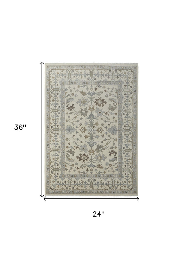 HomeRoots 4' Hand-Knotted Wool Area Rug with Floral Design and Tassel Fringe for Timeless Home Décor 2' X 3' 566291